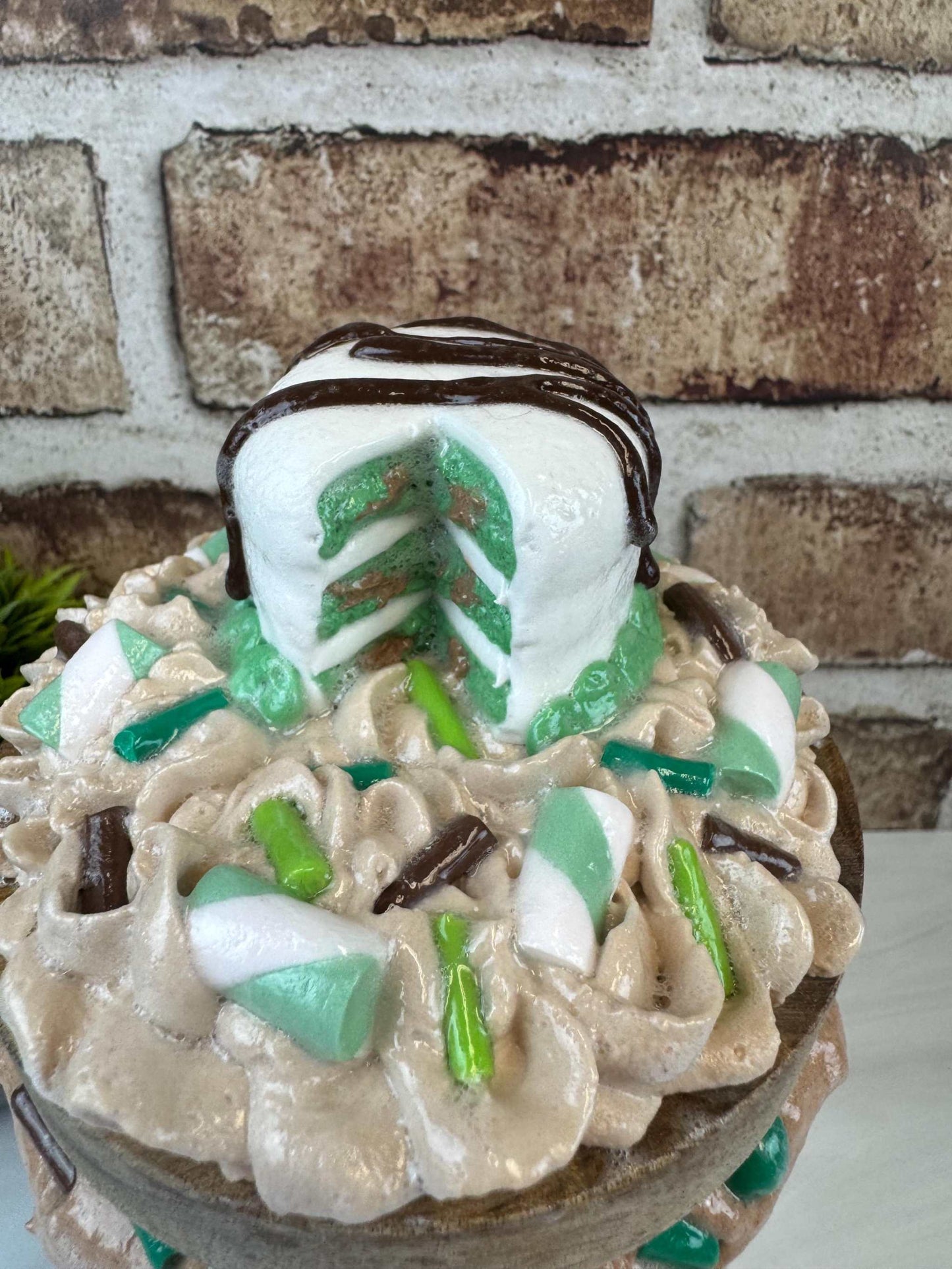 Mint chocolate chip cake jar kitchen decor with whipped cream and candy toppings