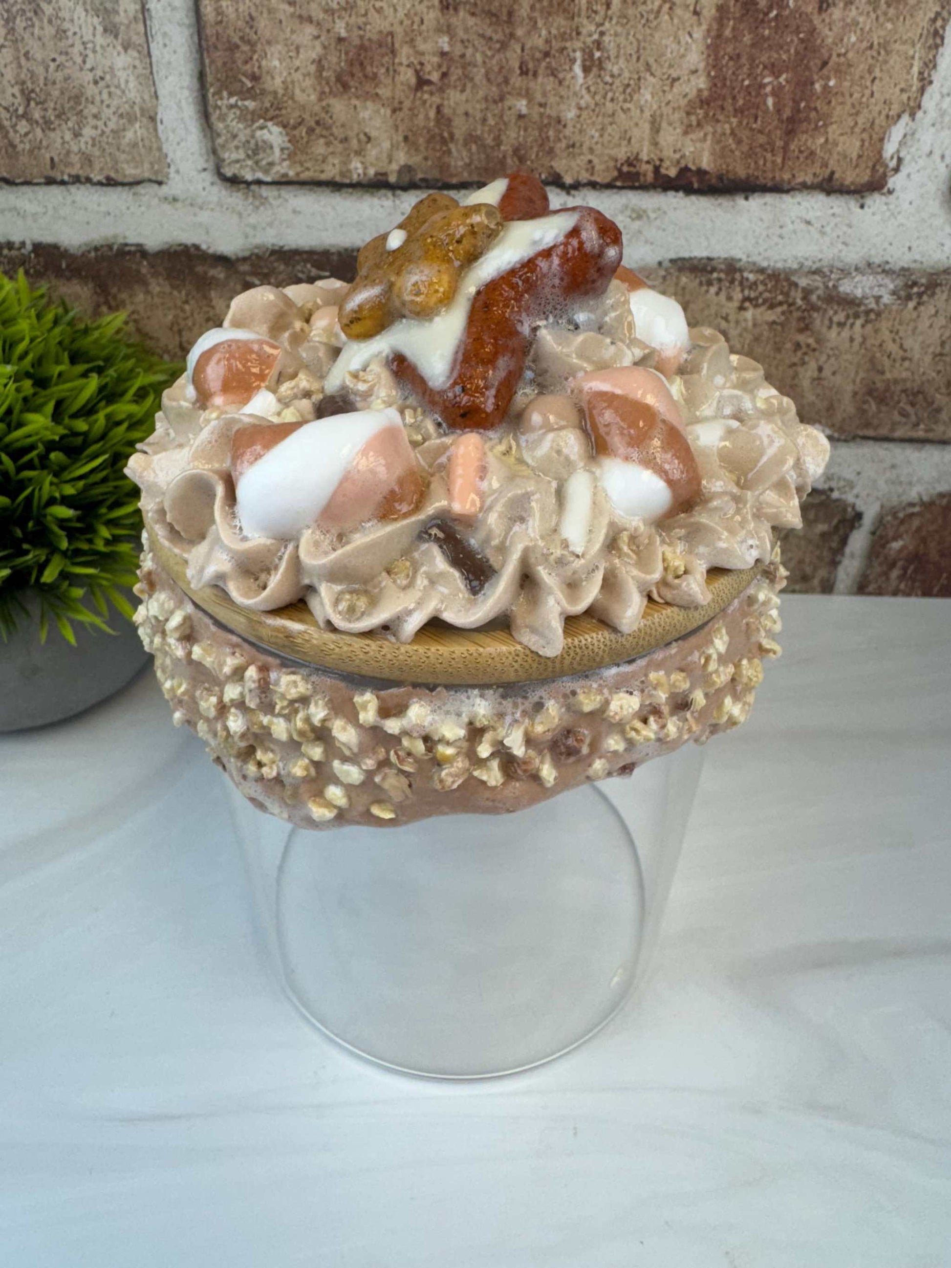 Sweet treat jar with faux whipped topping and decorative fake nuts cookie storage container