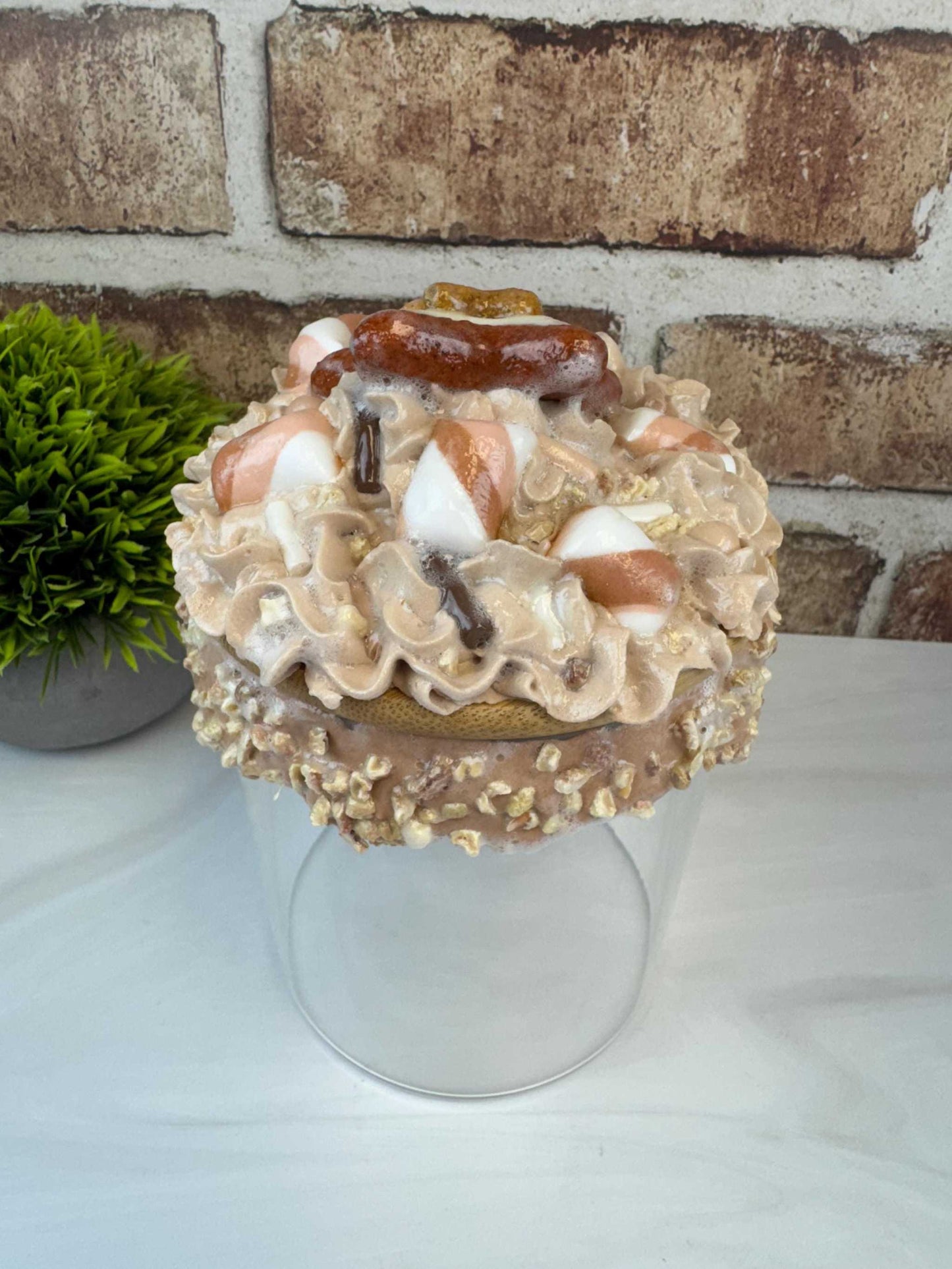 Sweet treat jar with faux whipped topping and fake nuts cookie storage container