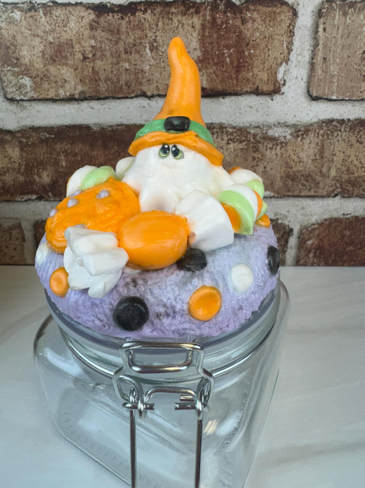 Spooky sweet treat jar with Halloween ghost and candy decorations on lid