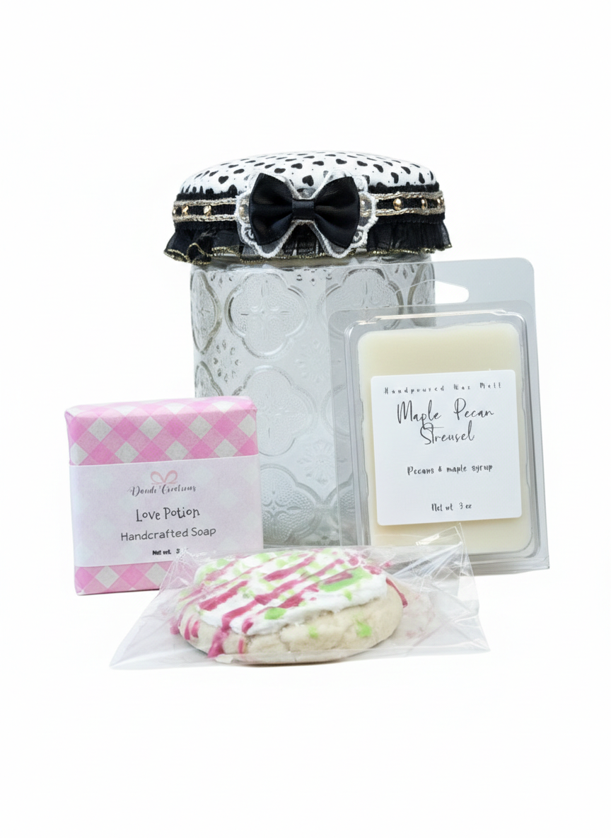 Collection of bath and body products including a jar, soap, and packaging on a white background