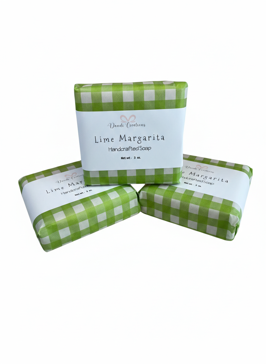 Three bars of Lime Margarita soap with green checkered wrappers on a white background