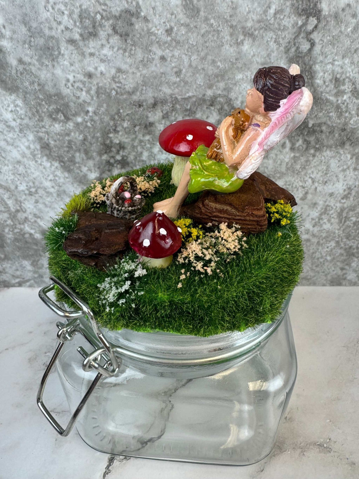 magical fairy garden themed glass jar with fairy and mushrooms miniature decor