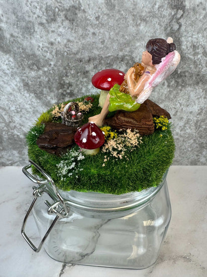 magical fairy garden themed glass jar with fairy and mushrooms miniature decor