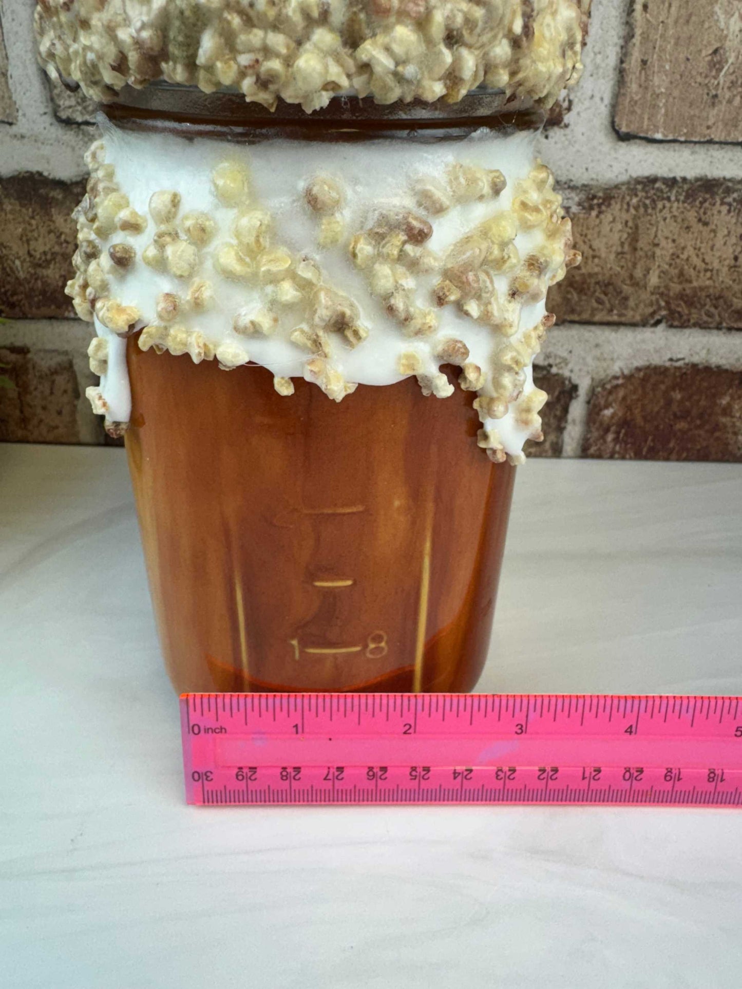 Sweet treat mason jar with faux donut and whipped topping dessert decor