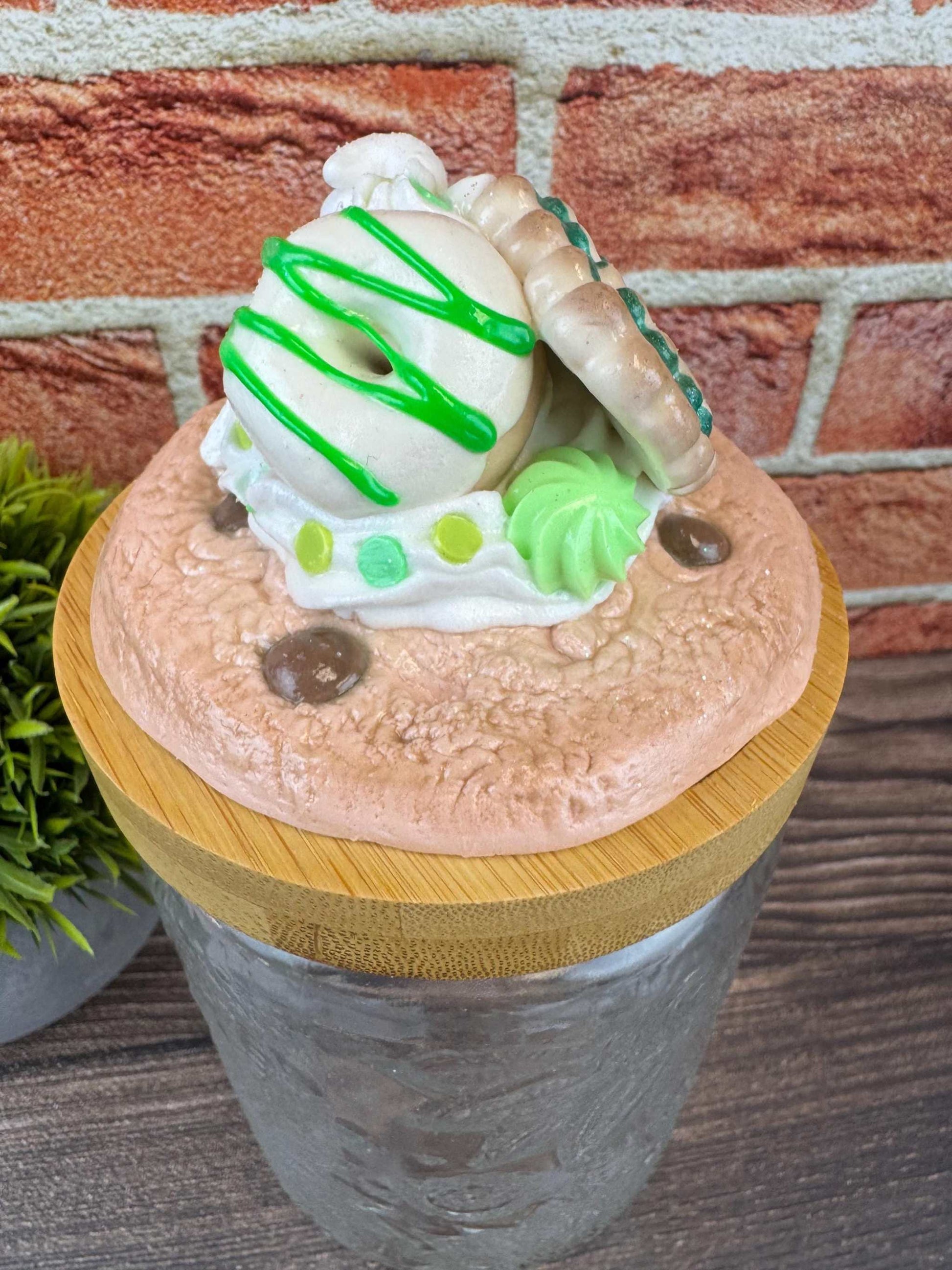 Faux chocolate chip cookie sweets jar with decorative lid featuring cookies and cream accents, ideal for kitchen decor or gifting.