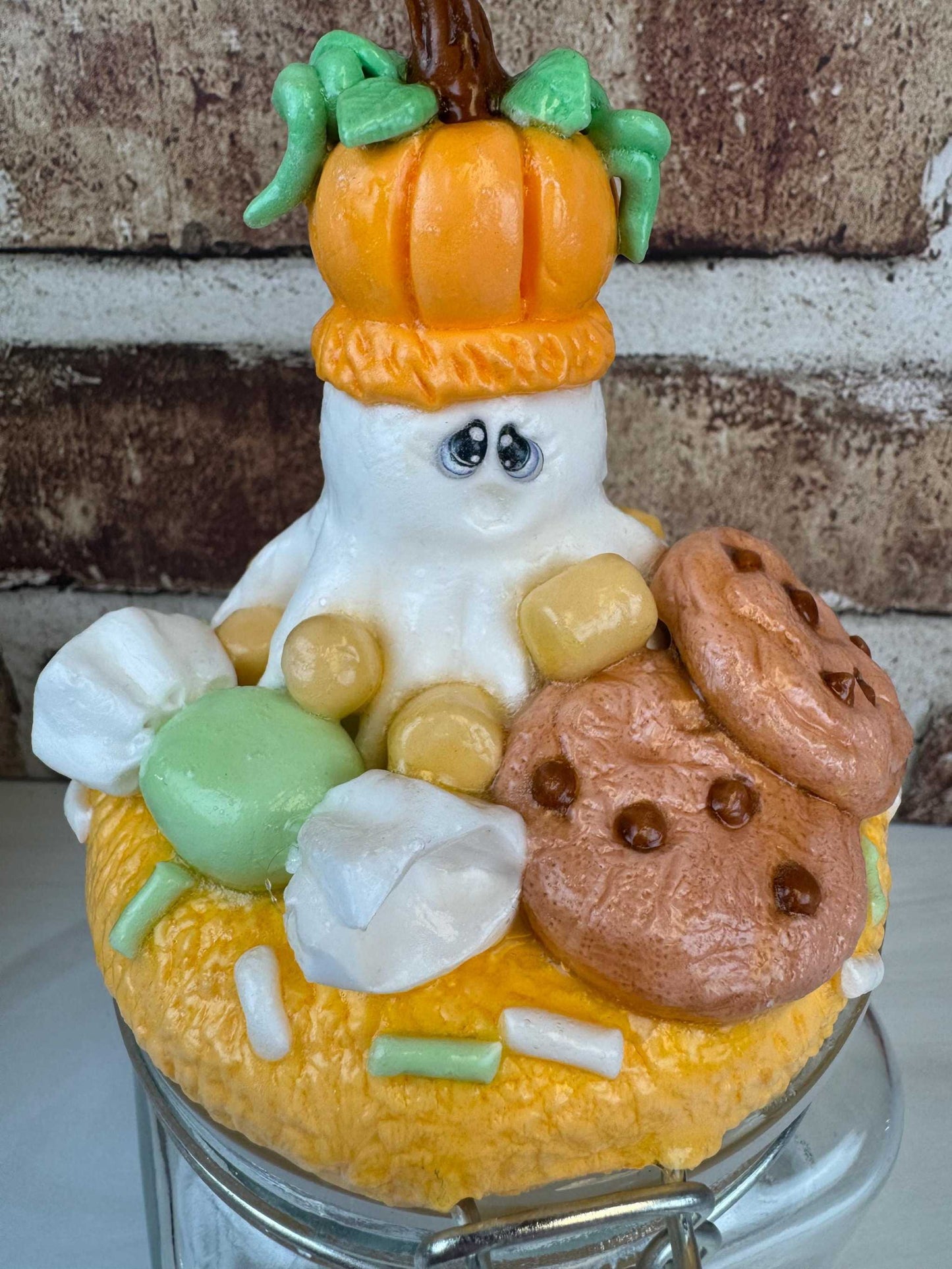 Ghost pumpkin treat jar with ghost, pumpkin, and Halloween cookies design