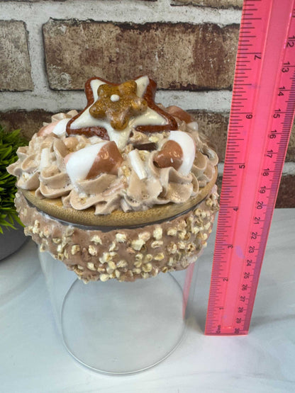 Sweet treat jar with faux whipped topping, fake nuts, and cookie decoration measuring about 7 inches tall