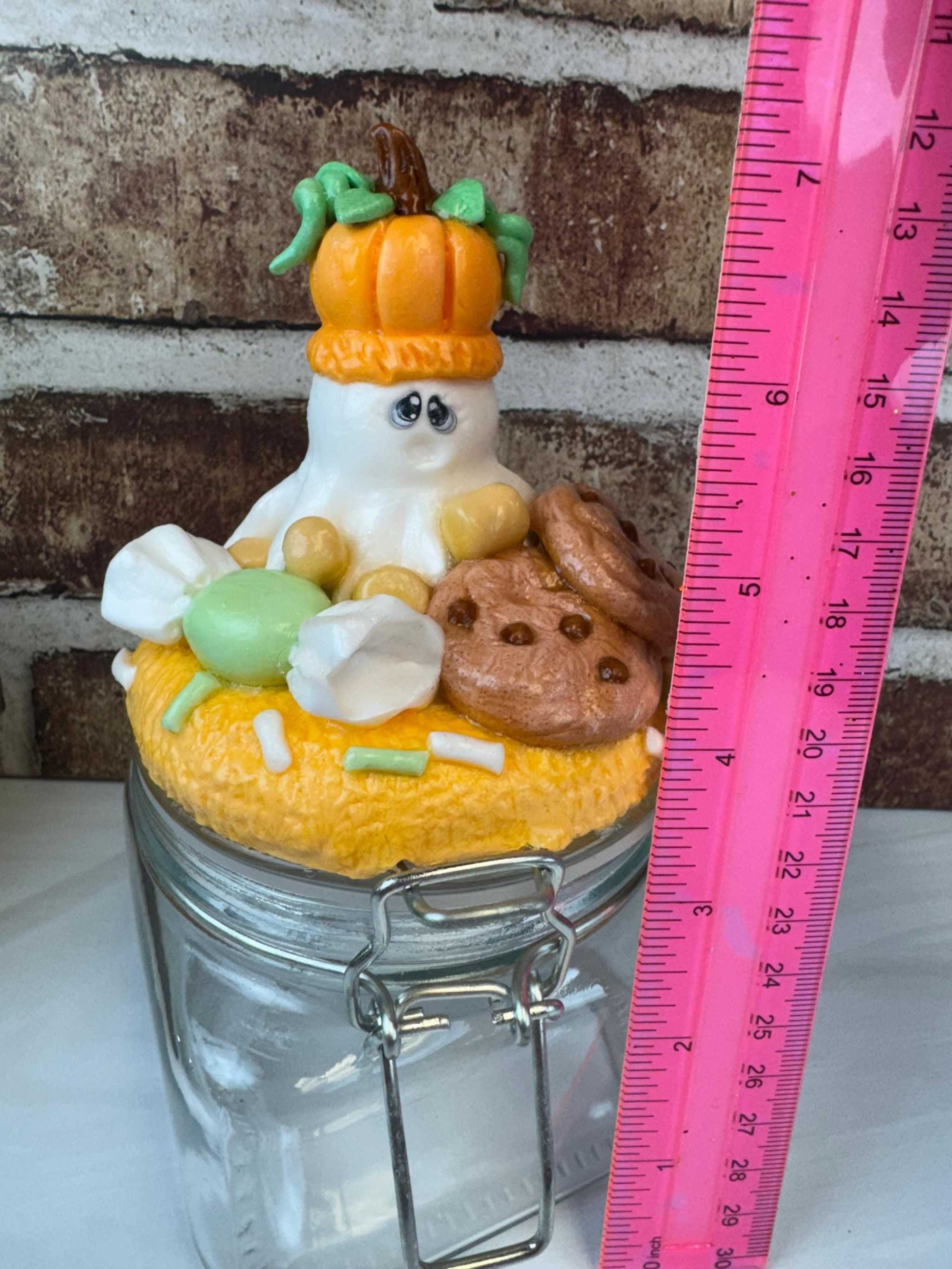 Ghost pumpkin treat jar with ghost, pumpkin, candy, and cookie design for Halloween storage