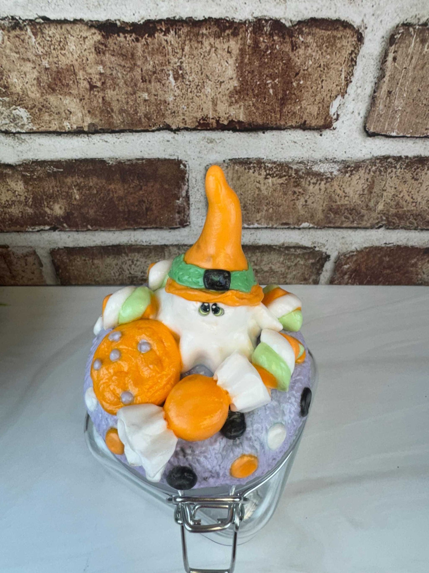 Spooky sweet treat jar with Halloween ghost, candy, and cookie decoration